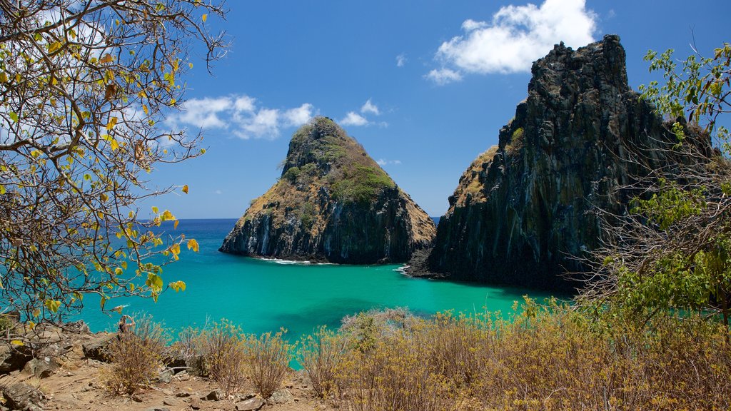 Dois Irmaos Hill which includes rugged coastline, island images and general coastal views