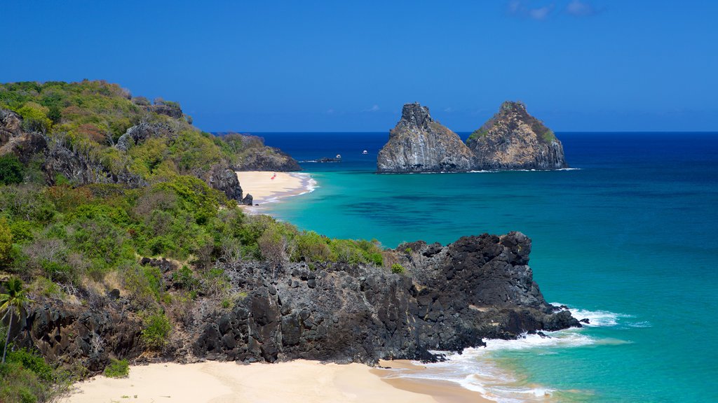 Dois Irmaos Hill showing a beach, general coastal views and rugged coastline