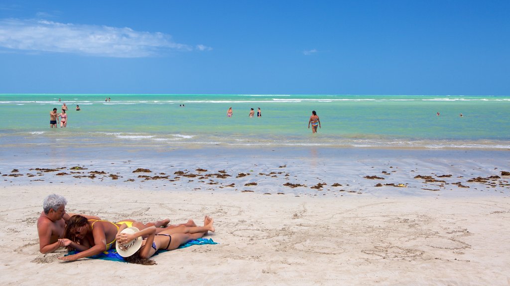 Playa Paripueira que incluye natación, vista general a la costa y una playa de arena