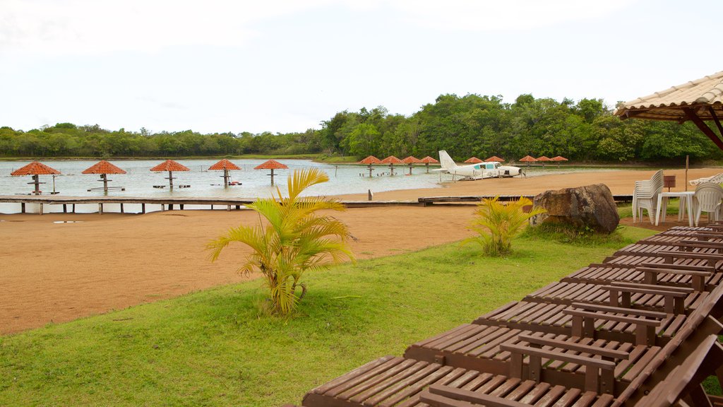 Figueira Beach which includes general coastal views and a sandy beach