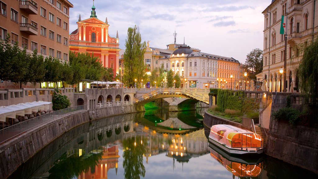 Triple Bridge featuring boating, night scenes and a bridge