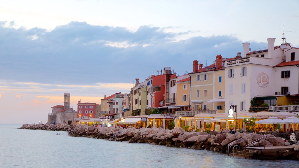 Piran featuring a coastal town, a sunset and outdoor eating