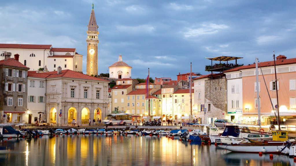 Piran featuring night scenes, boating and a marina