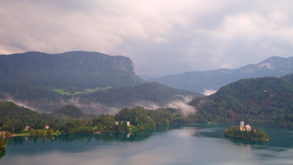 Lake Bled featuring forests, mountains and a lake or waterhole