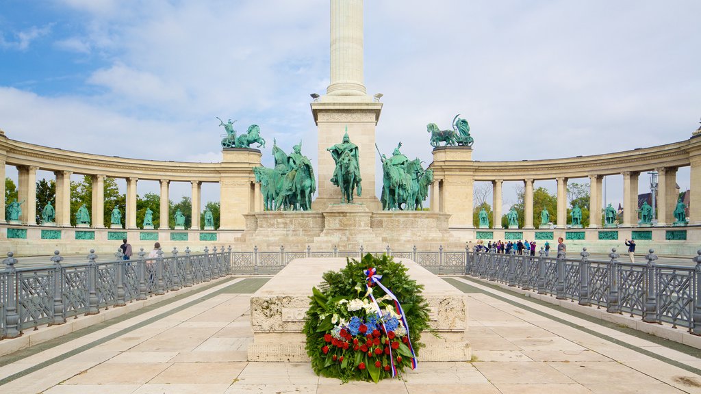 Heroe\'s Square which includes flowers and a statue or sculpture