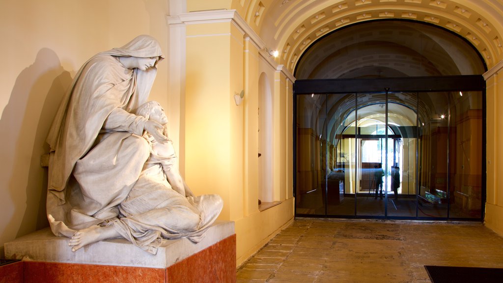 Pecs showing interior views, a statue or sculpture and a castle