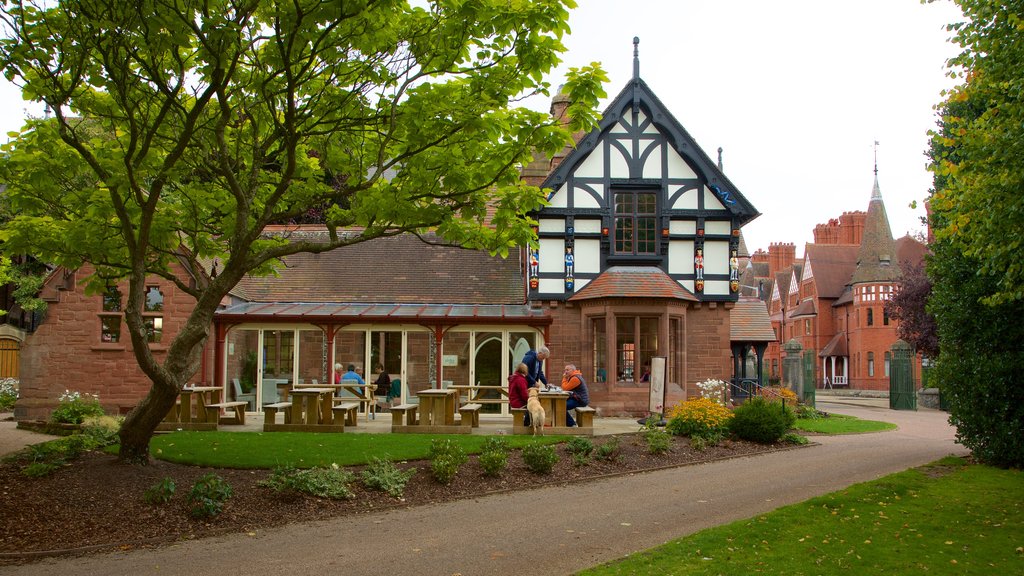 Grosvenor Park showing outdoor eating and a garden as well as a small group of people