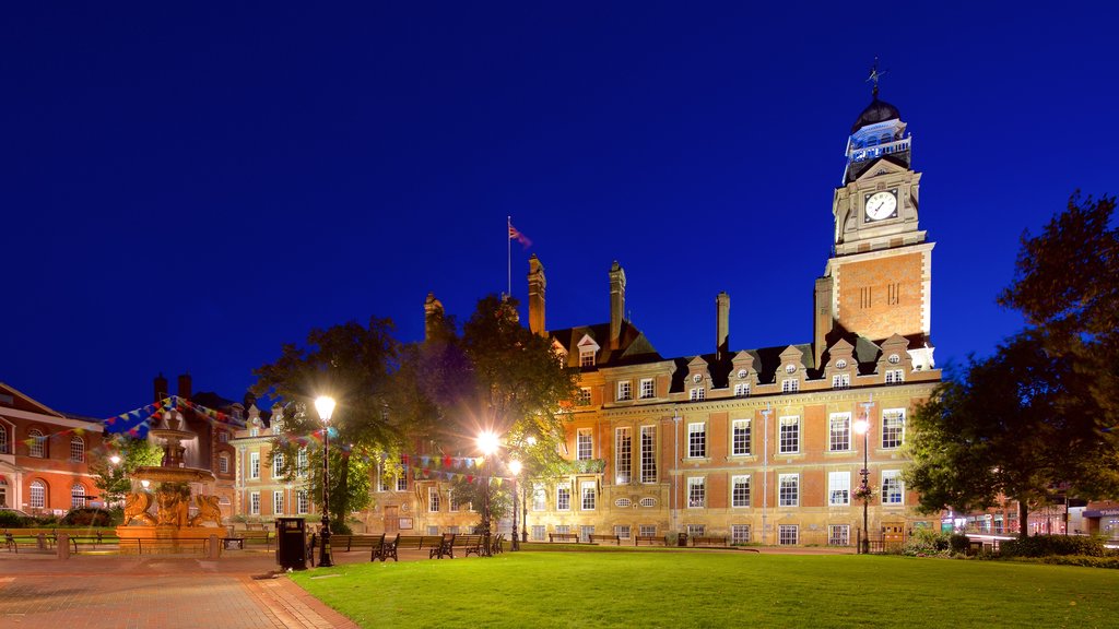 Leicester Town Hall showing night scenes, a square or plaza and heritage architecture