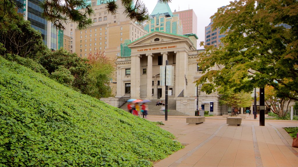 Robson Street which includes a city, heritage architecture and a square or plaza