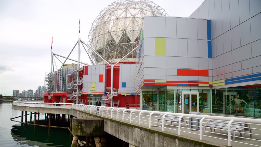 TELUS World of Science which includes a bay or harbour and modern architecture