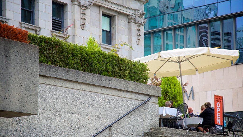 Granville Street which includes outdoor eating as well as a small group of people