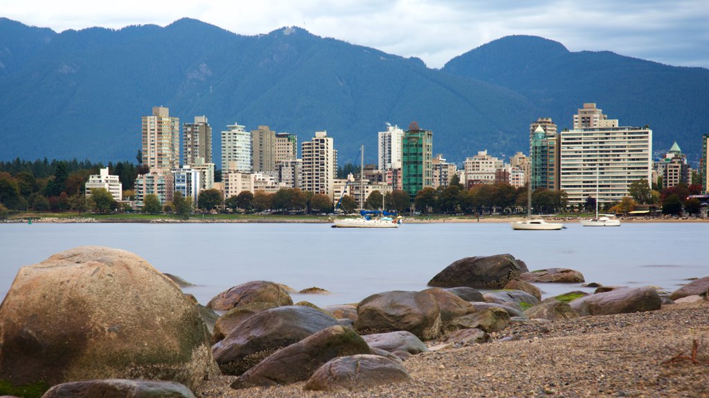 Kitsilano Beach which includes a city, mountains and a bay or harbour