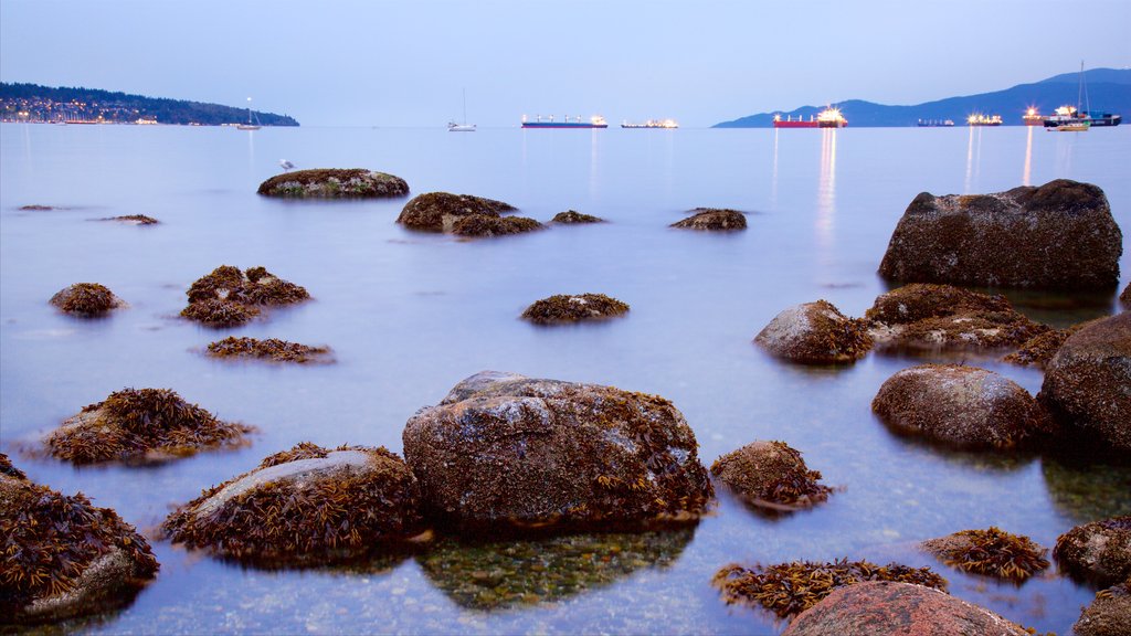 Kitsilano Beach which includes a bay or harbour, a sunset and general coastal views