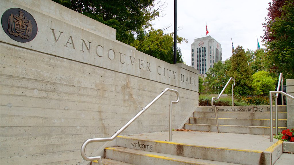 Vancouver showing signage, an administrative building and a park