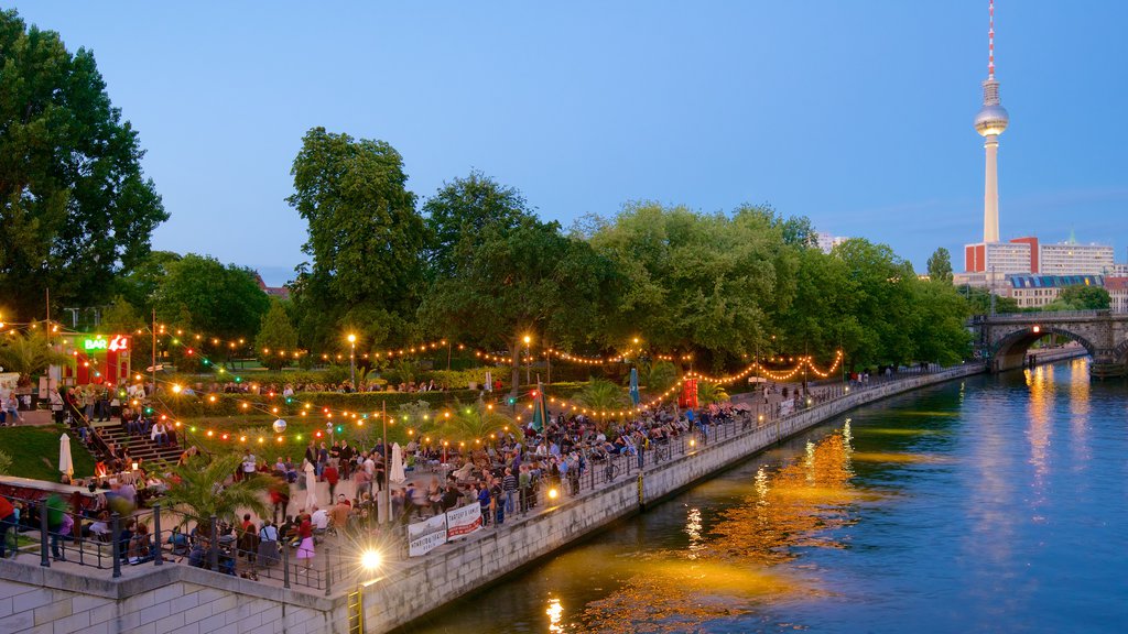 Berlin featuring street scenes and a river or creek as well as a large group of people