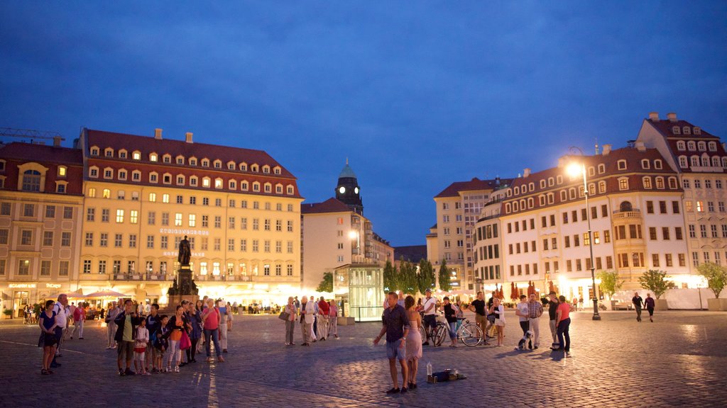 New Market Square featuring night scenes and a square or plaza as well as a large group of people