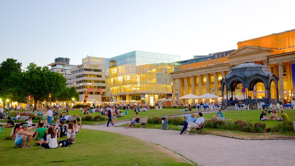 Schlossplatz showing a park as well as a large group of people