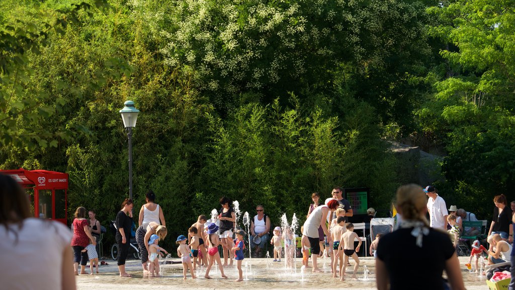 Leipzig Zoo which includes a square or plaza and a fountain as well as a large group of people