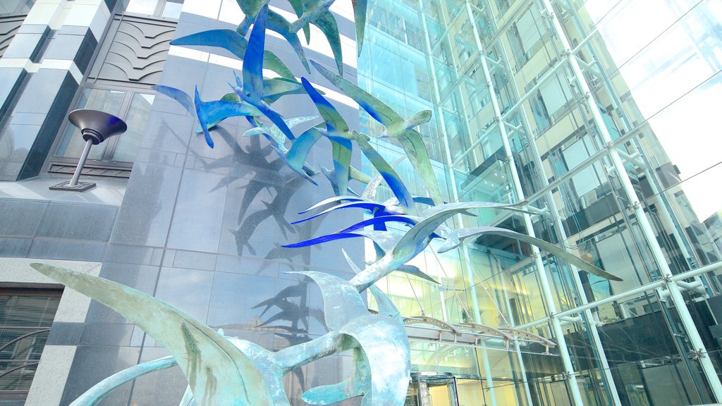 Leeds City Square which includes outdoor art, a city and a high rise building