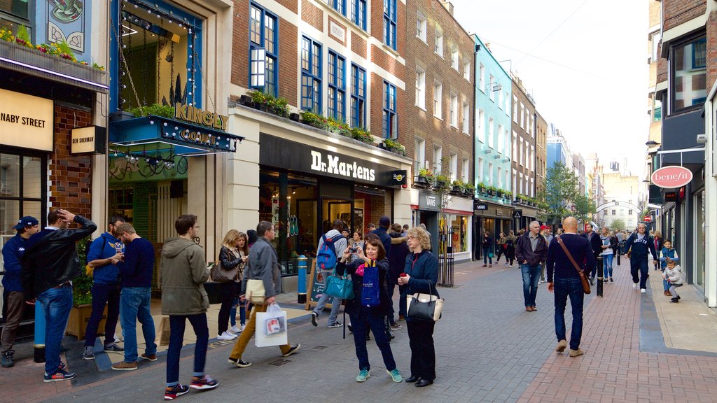 Carnaby Street showing shopping, a square or plaza and heritage architecture