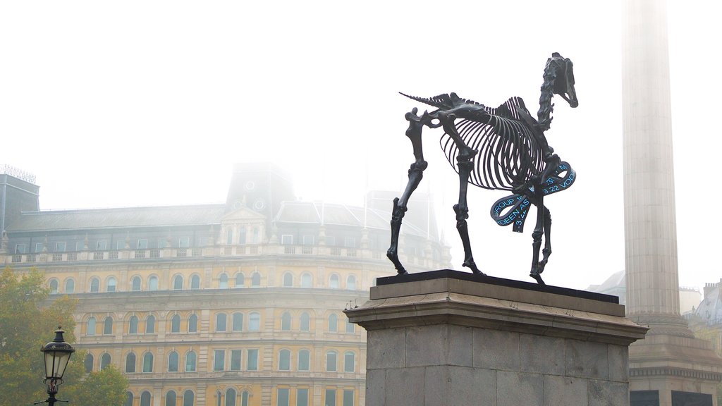 Trafalgar Square showing mist or fog and a statue or sculpture