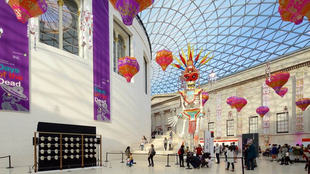 The British Museum featuring interior views as well as a large group of people