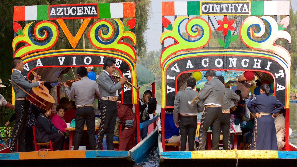 Xochimilco showing boating, music and a river or creek