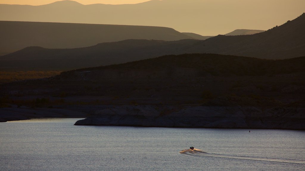 Elephant Butte which includes a lake or waterhole, mountains and a sunset