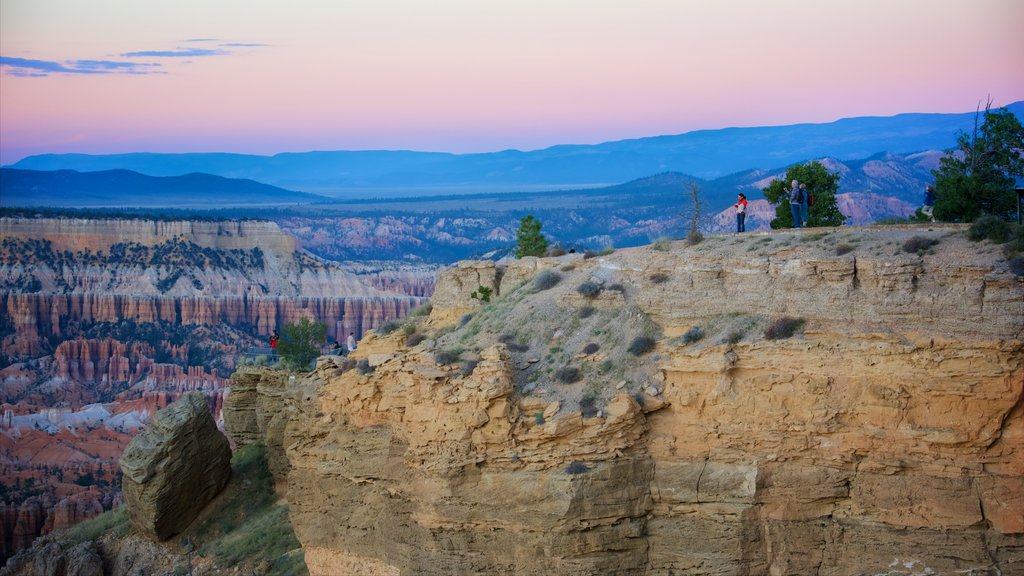 Bryce Point showing a gorge or canyon, desert views and a sunset