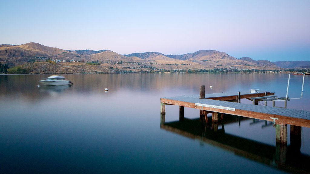 Lake Chelan showing a lake or waterhole, a sunset and tranquil scenes