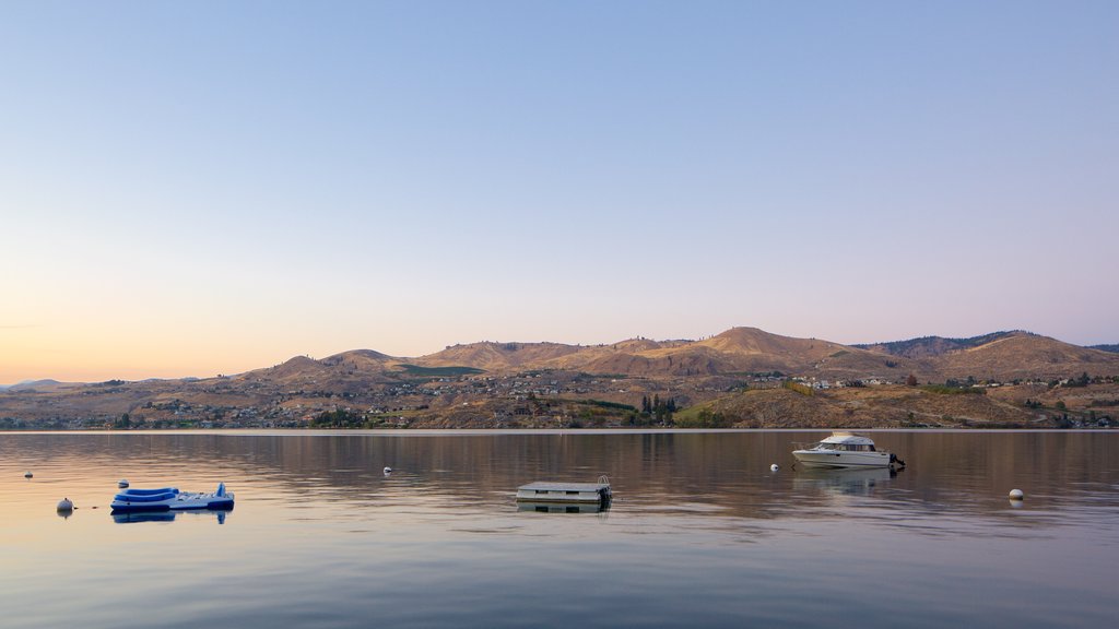 Lake Chelan which includes boating, a sunset and a lake or waterhole