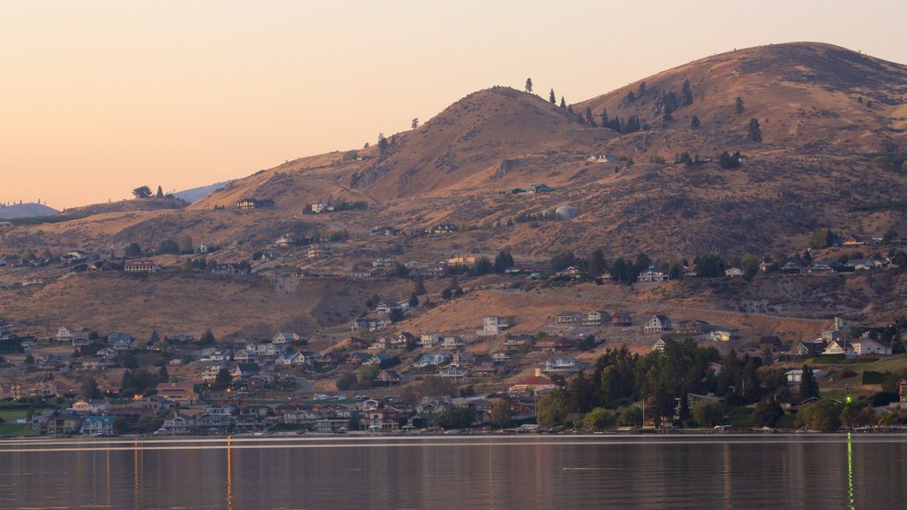 Lake Chelan which includes a coastal town, general coastal views and a sunset