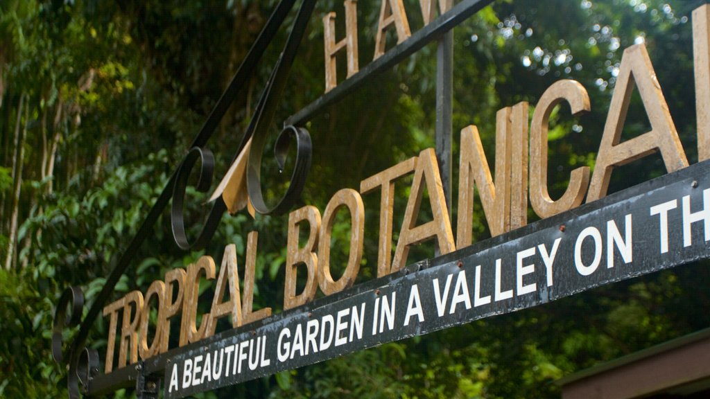 Hawaii Tropical Botanical Garden showing signage and a park