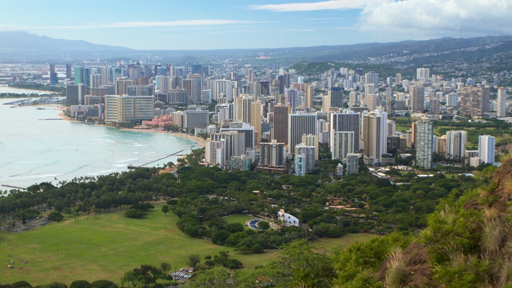 Diamond Head which includes a city, skyline and general coastal views