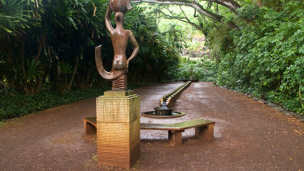 Allerton Botanical Garden showing a statue or sculpture and a garden