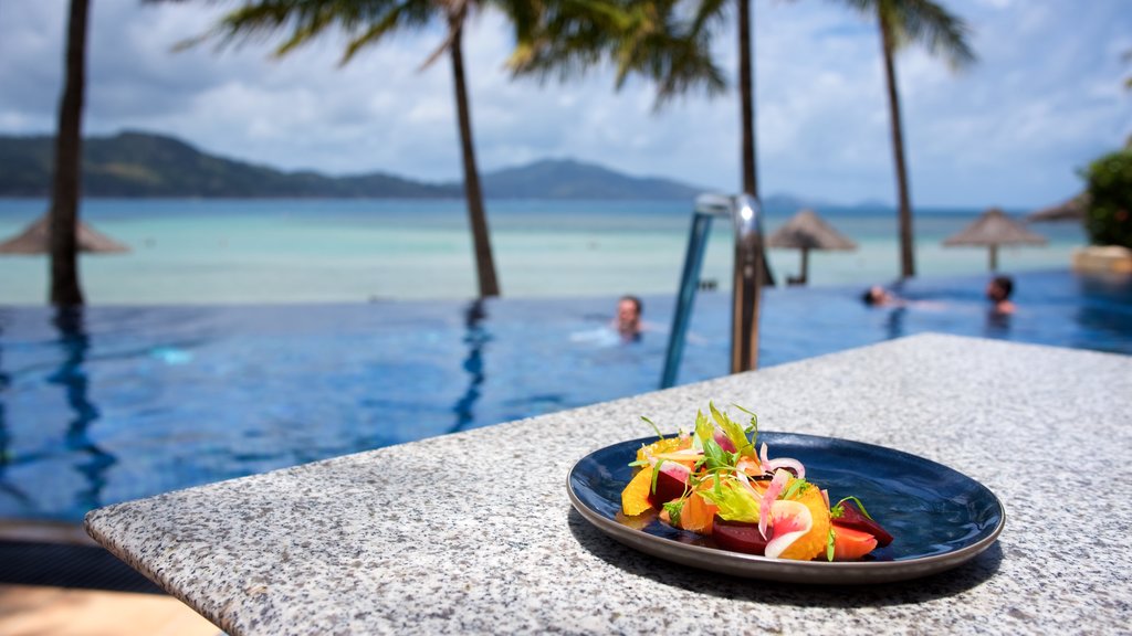 Hamilton Island showing food and a luxury hotel or resort