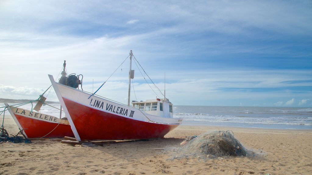 Punta del Diablo featuring signage and general coastal views