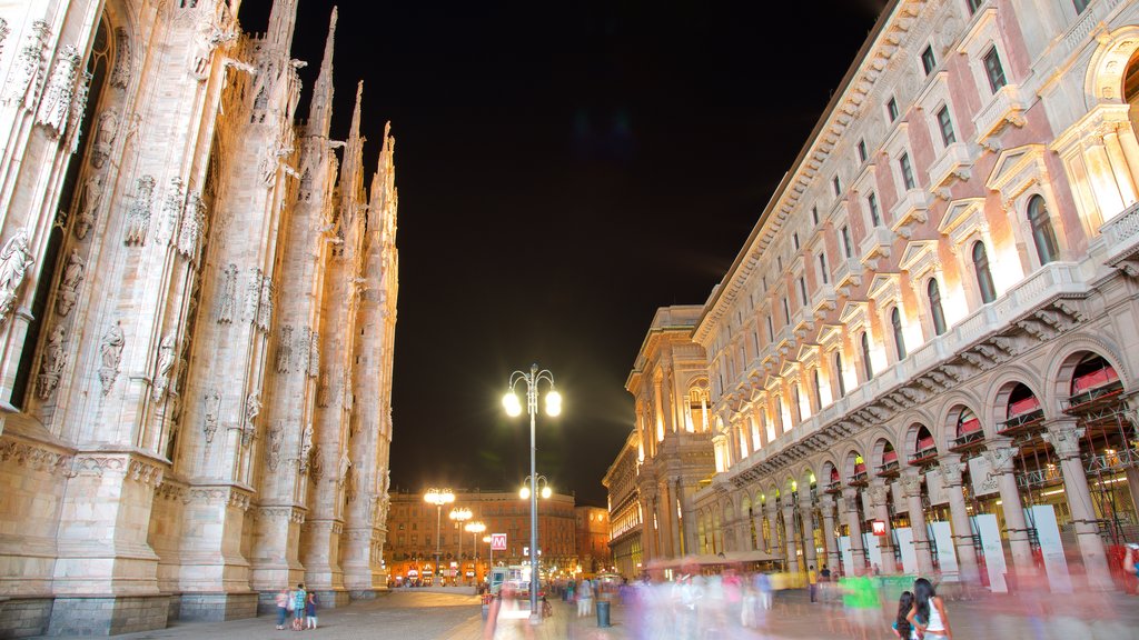 Piazza del Duomo showing night scenes, an administrative building and heritage architecture