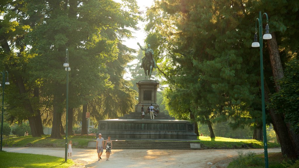 Sempione Park which includes a park, a monument and a statue or sculpture