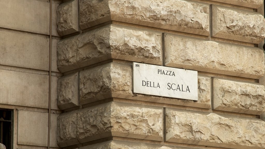 Piazza della Scala featuring heritage architecture, a castle and signage