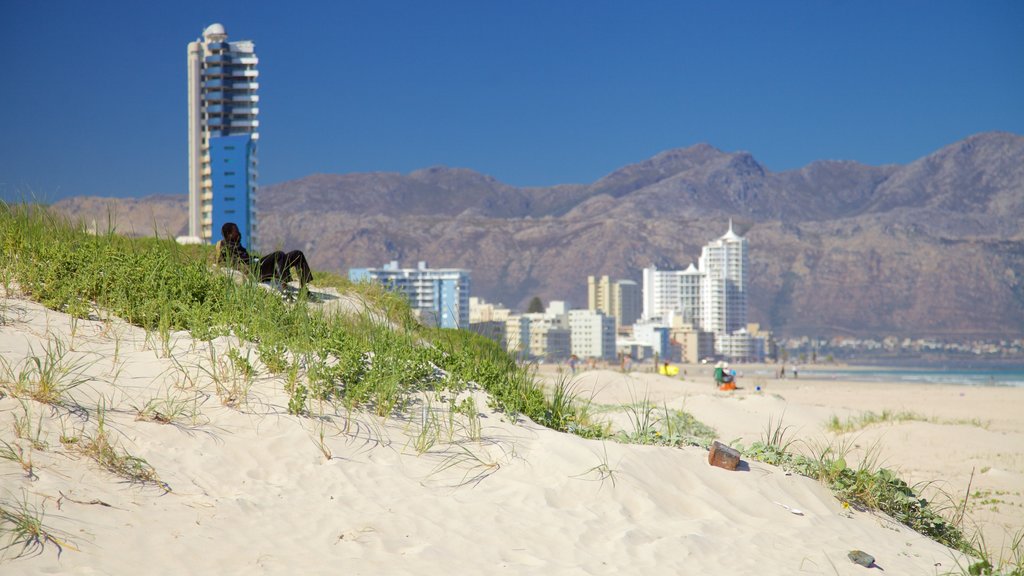 Strand featuring landscape views, mountains and a beach