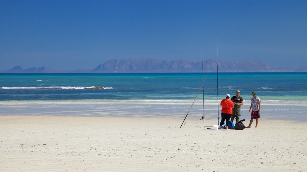 Strand which includes a beach and fishing as well as a small group of people