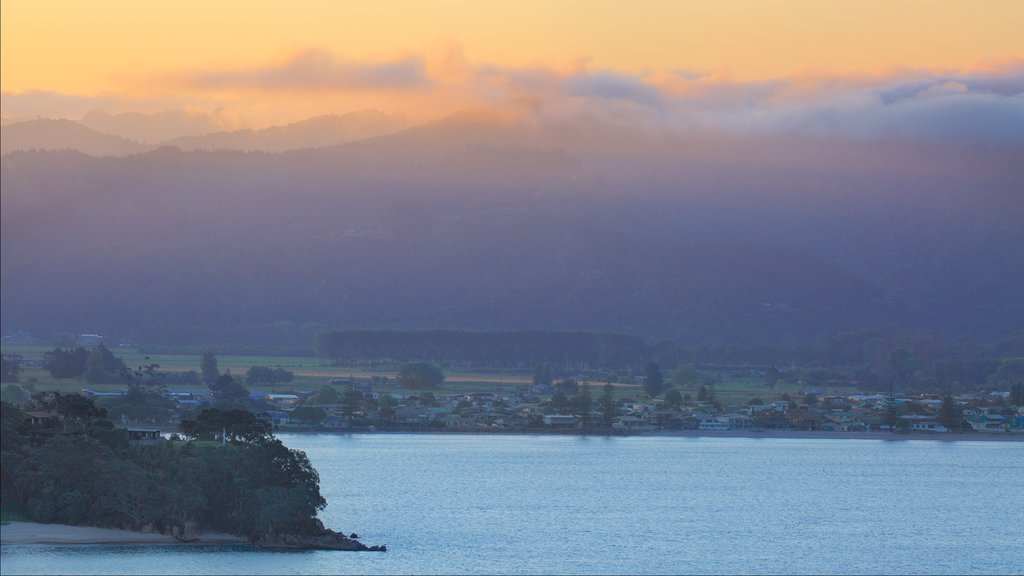 Whitianga which includes a bay or harbour, a coastal town and a sunset