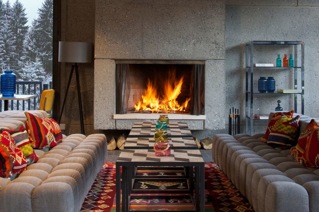 fireplace and living area in terminal neige - totem hotel, flaine