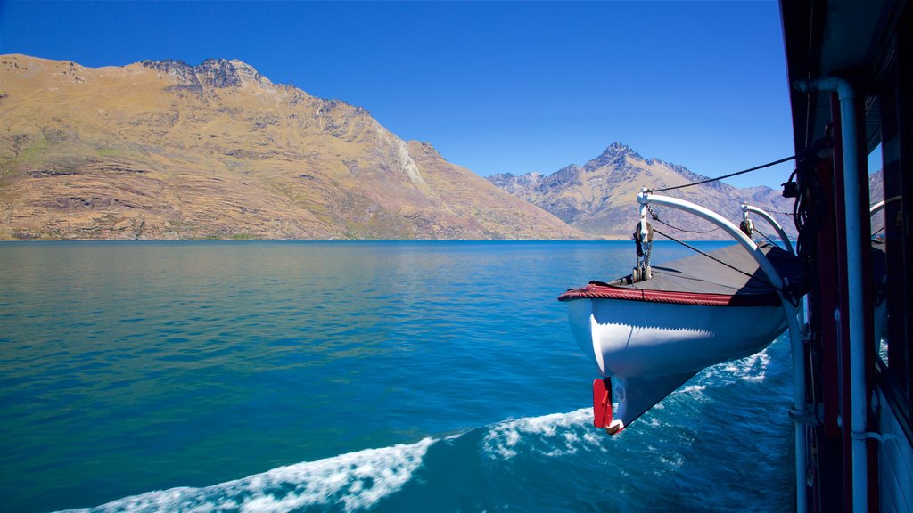 Queenstown showing boating, a river or creek and mountains