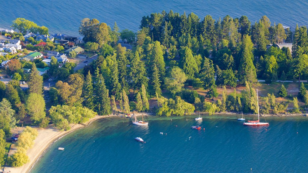 Queenstown Beach featuring a small town or village, a sandy beach and a lake or waterhole