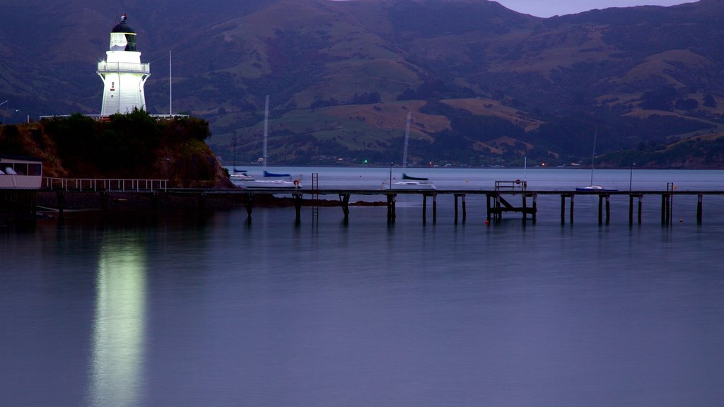 Akaroa which includes a sunset, tranquil scenes and a lighthouse