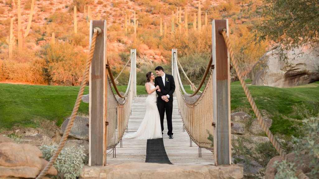 Marana featuring desert views and a bridge as well as a couple