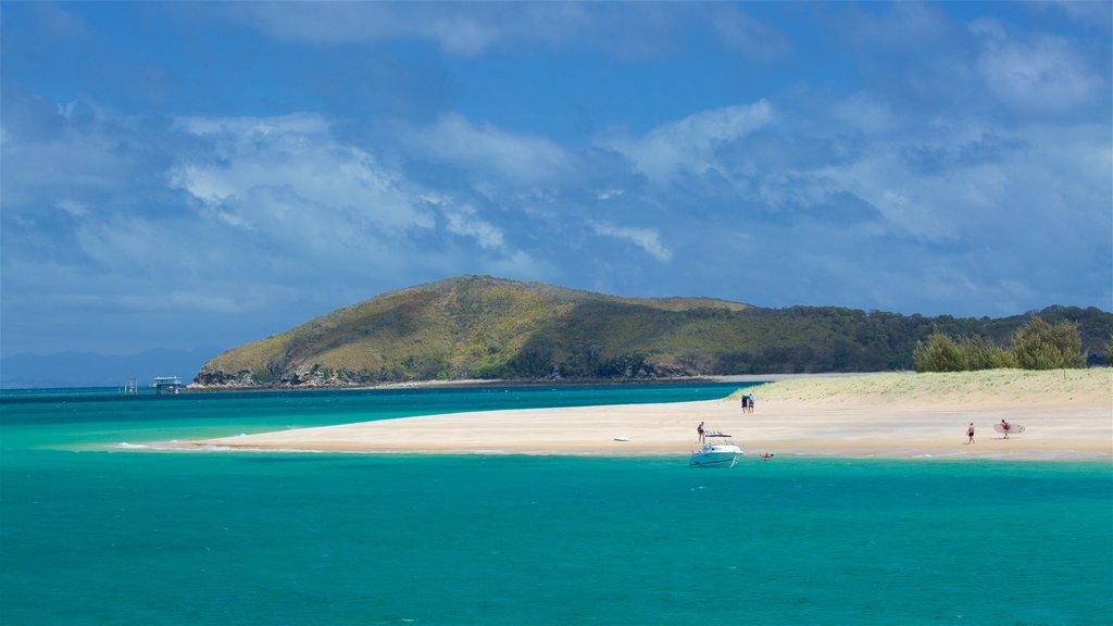 Great Keppel Beach featuring a bay or harbour, general coastal views and a sandy beach