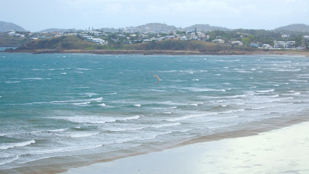 Yeppoon showing a sandy beach, waves and kite surfing